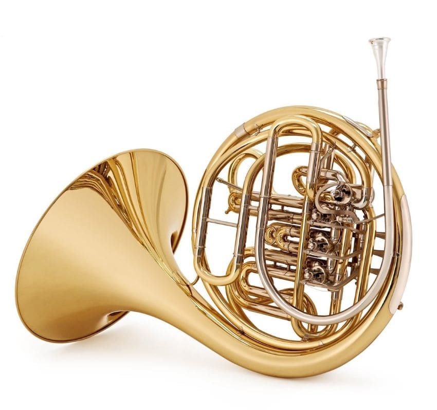 A french horn laying on the floor