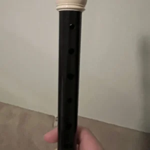 A front view of Hannah's Yamaha black recorder